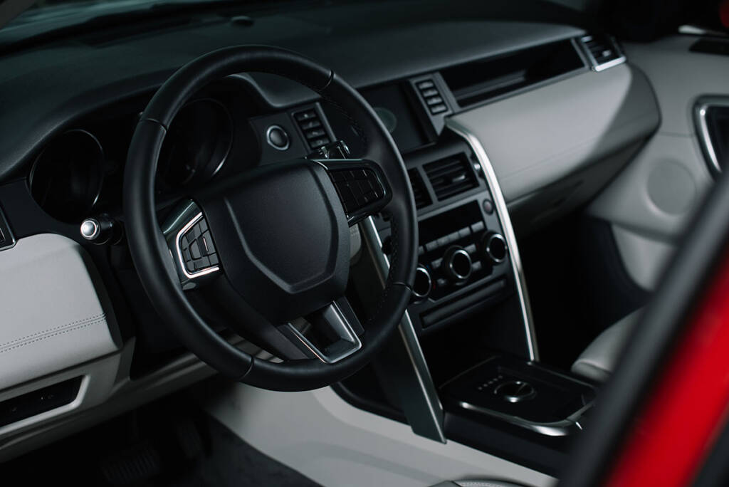 black steering wheel with buttons in automobile 2021 09 14 20 36 22 utc copy